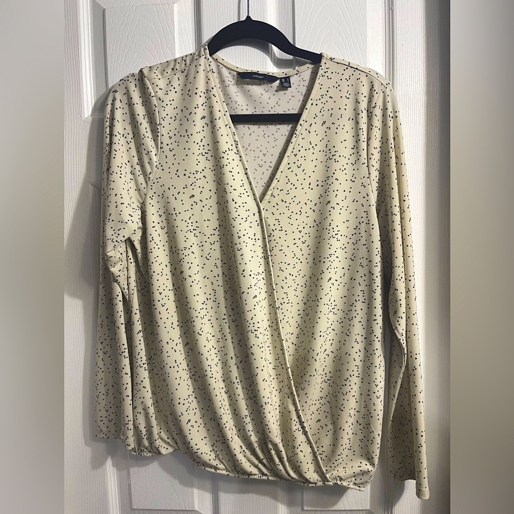 Cream colored blouse with black hearts